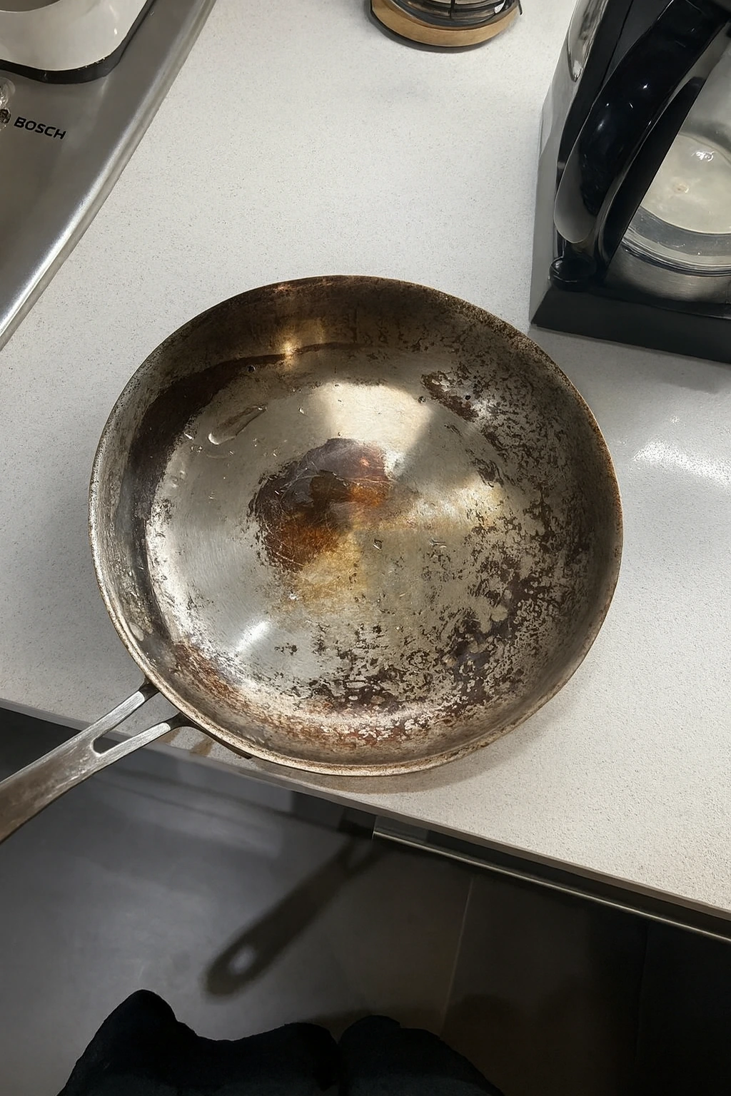 Old worn-out pan with degraded coating