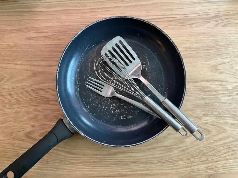 Non-stick pan scratched by metal utensils